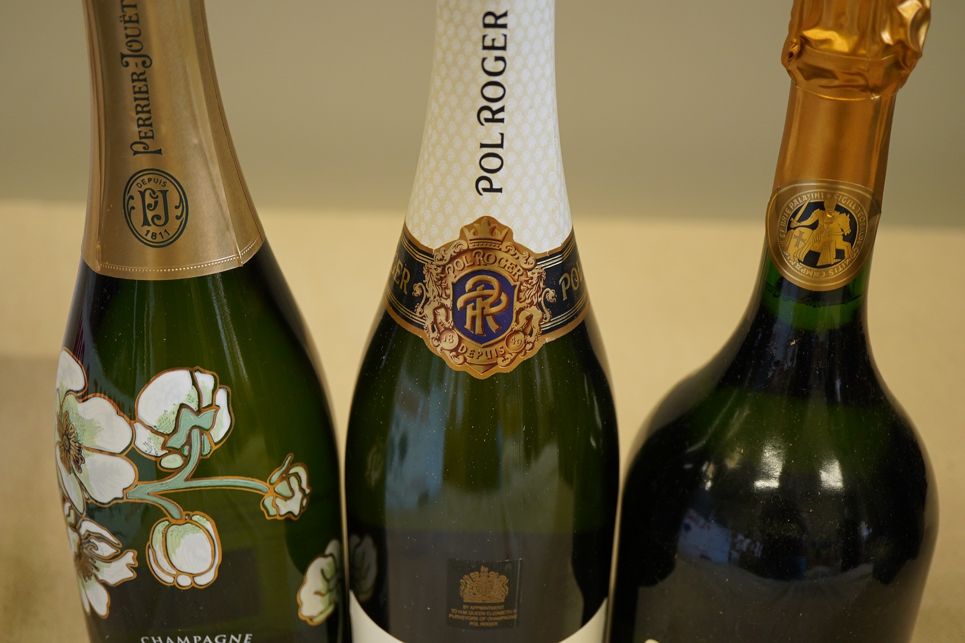 A bottle of 2007 Perrier - Jouet Belle Epoque Champagne, a bottle of Taittinger Comtes Champagne and a bottle of Pol Roger Extra Cuvee Reserve Champagne (3)